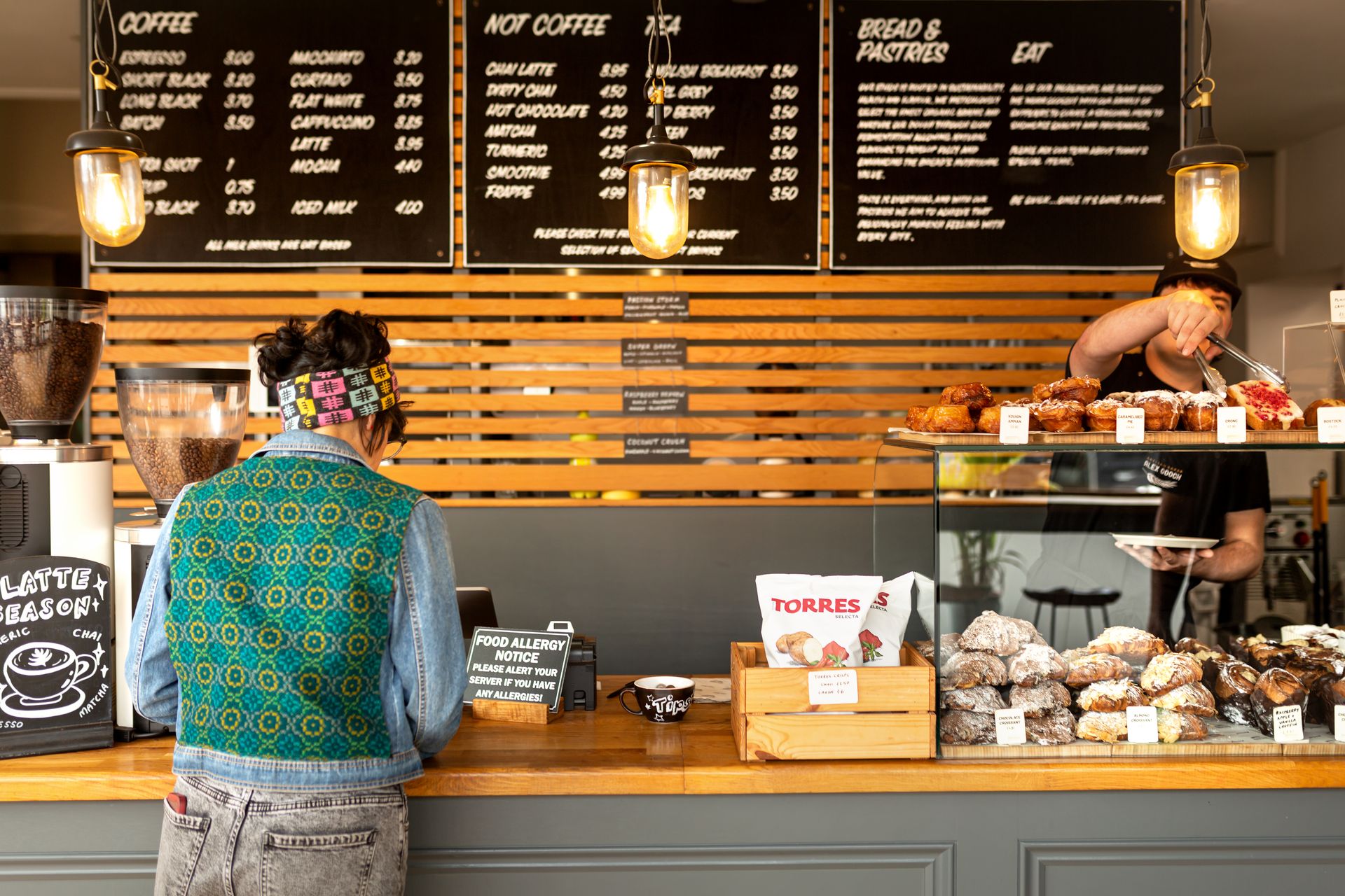 A woman being served at the Alex Gooch Bakery, Whitchurch Road, Cardiff.