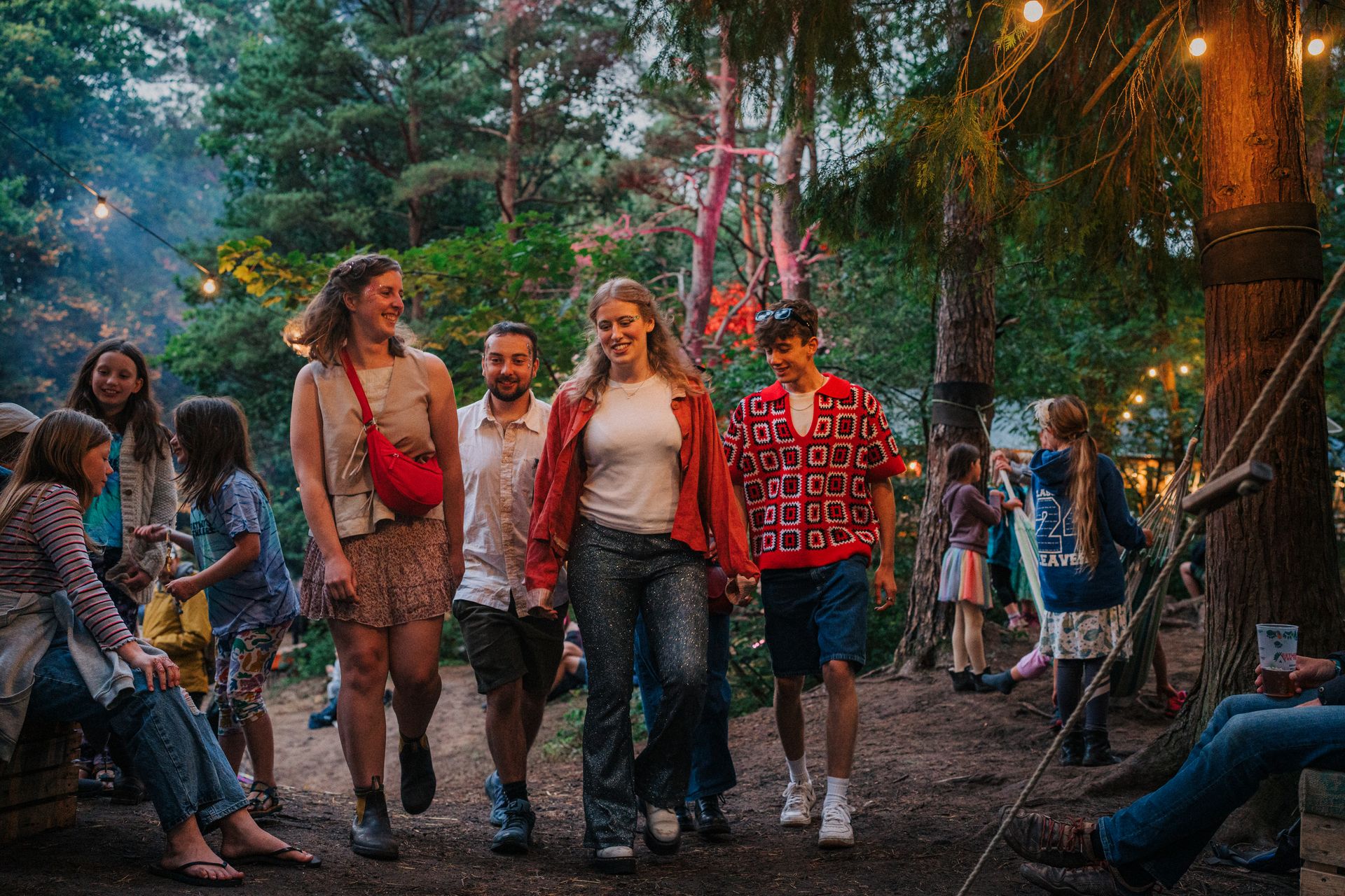 A group of young people at the Between the Trees festival, Candleston Woods, Merthyr Mawr, South Wales.