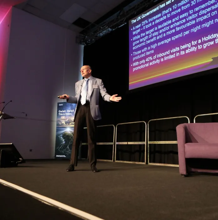 Image of David Edwards presenting at the Wales Tourism Summit 2025.