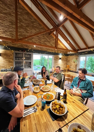 Group of cyclists enjoying dinner at The Lodge Staylittle