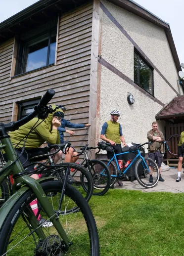 A group of cyclists gathering before a bike ride
