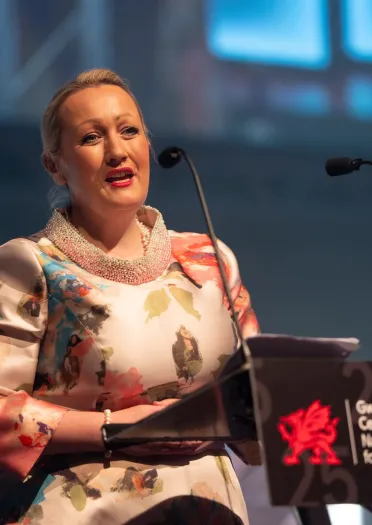 Image of Rebecca Evans MS the Cabinet Secretary for Economy, Energy and Planning welcoming everyone to the National Tourism Awards for Wales.