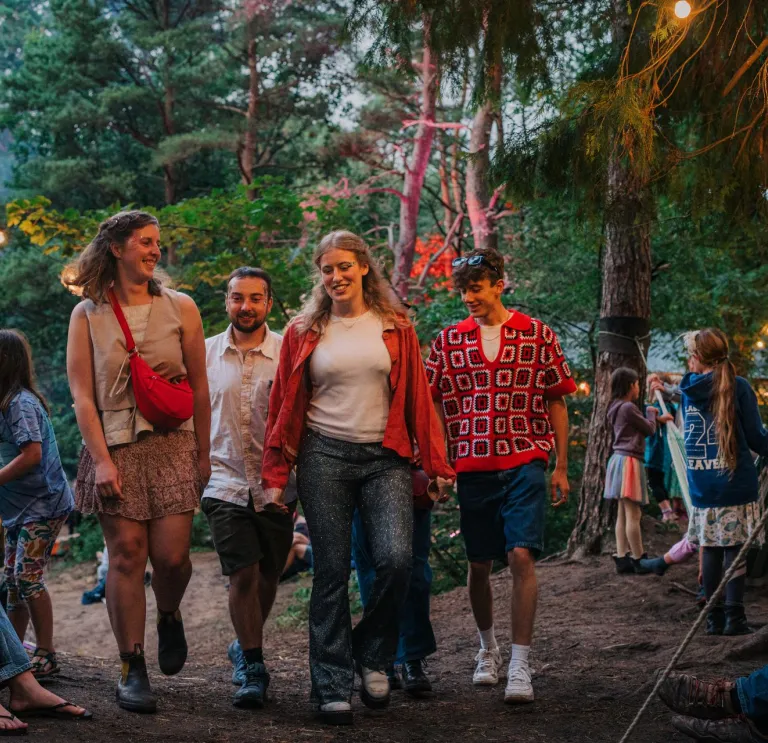 A group of young people at the Between the Trees festival, Candleston Woods, Merthyr Mawr, South Wales.