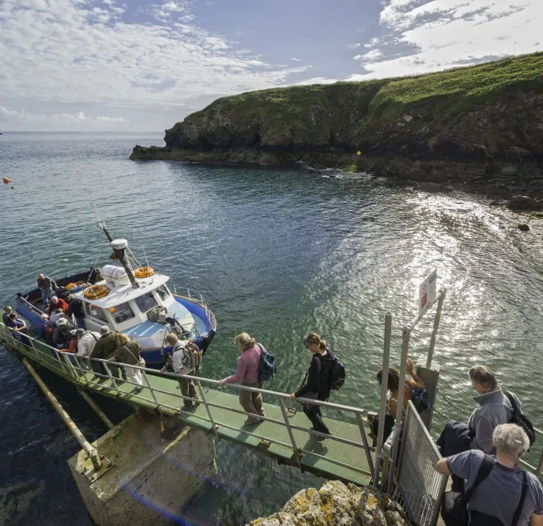 Group boarding Dale Princess boat at Martin's Haven, Skomer, Pembrokeshire.