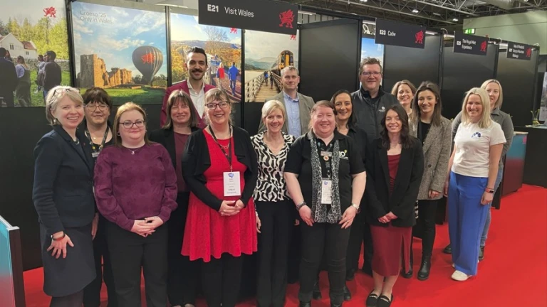 Group of exhibitors attending tourism event