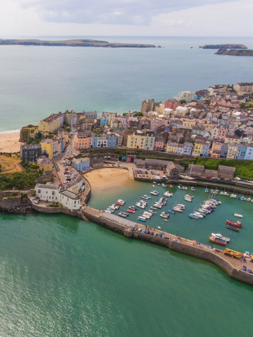 Looking down on Tenby onto the harbour, castle and beach