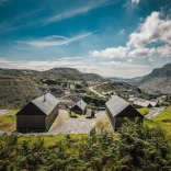 Three glamping huts looking out across Llechwedd slate mountains