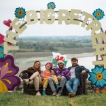 People sat beneath The Big Retreat festival arch